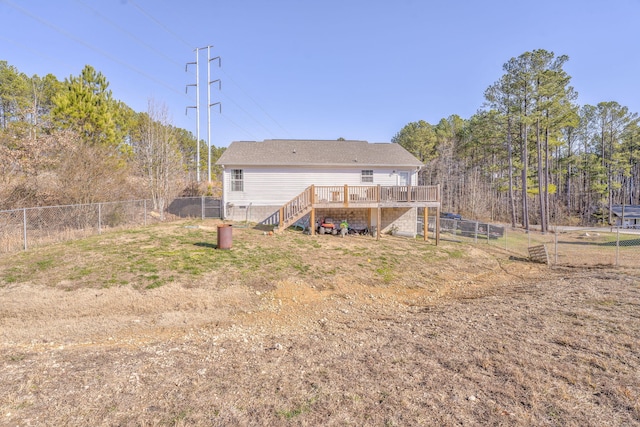 back of house featuring a wooden deck