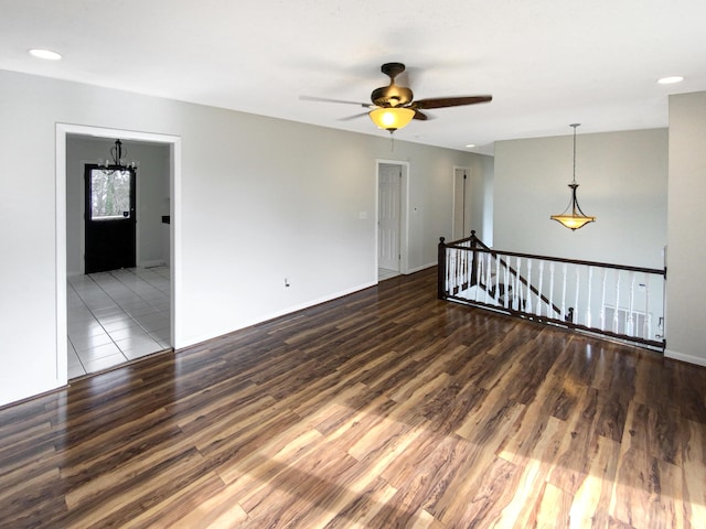 spare room with hardwood / wood-style flooring and ceiling fan