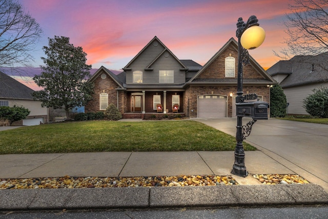 view of front facade with a garage and a yard