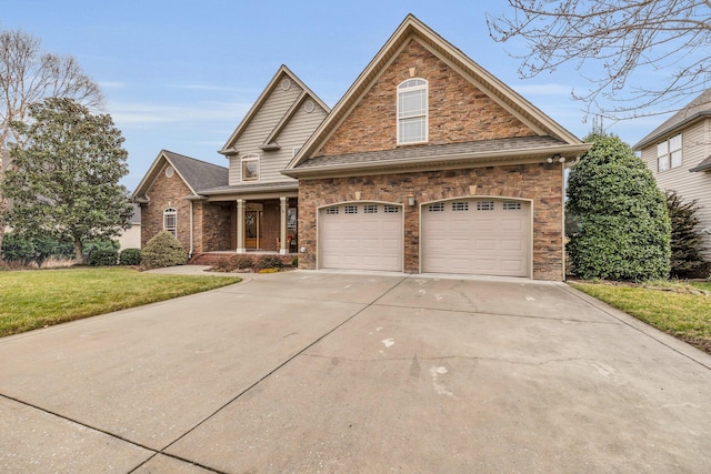 view of front of home with a garage, a front yard, and a porch