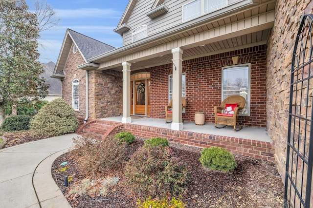 doorway to property featuring covered porch