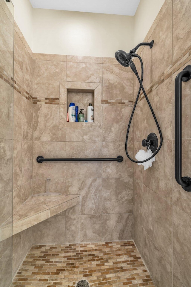 bathroom with a tile shower