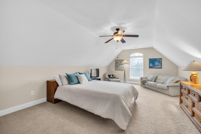 carpeted bedroom with ceiling fan and lofted ceiling