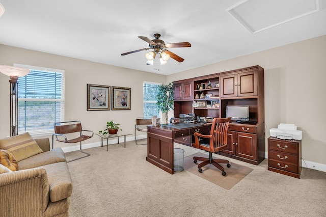 office featuring light carpet and ceiling fan