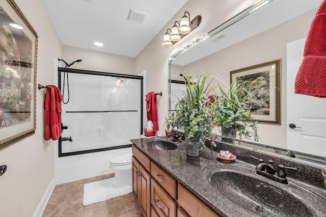 full bathroom with vanity, shower / bath combination with glass door, and toilet