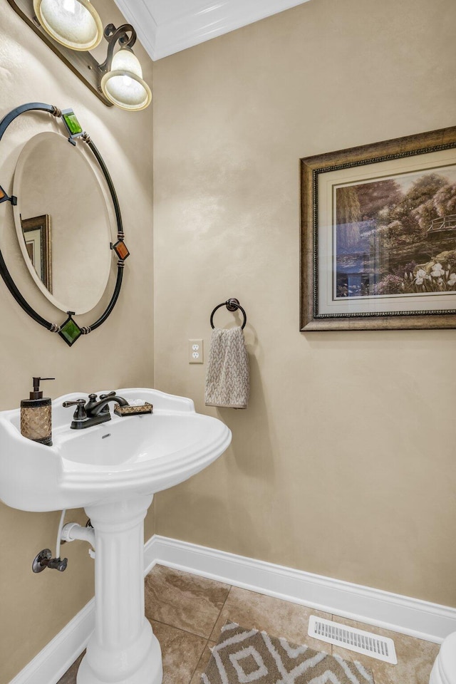 bathroom featuring crown molding and tile patterned floors