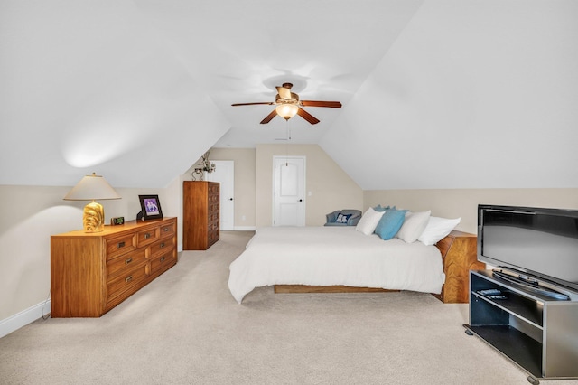 bedroom featuring light carpet, vaulted ceiling, and ceiling fan