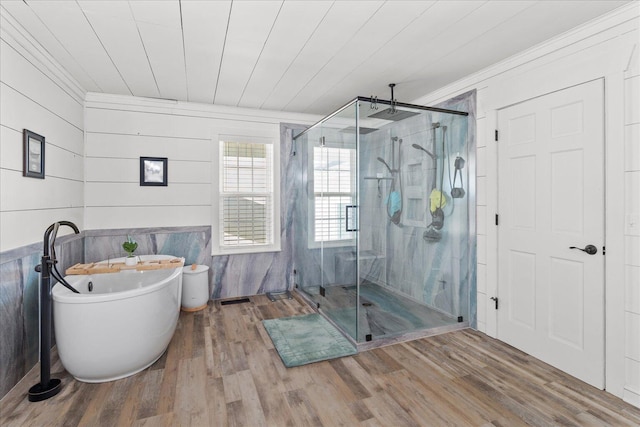 bathroom with wooden ceiling, a soaking tub, a marble finish shower, and wood finished floors