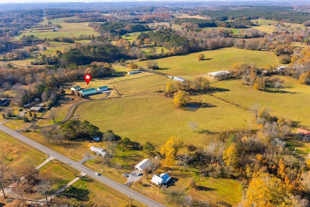 birds eye view of property with a rural view