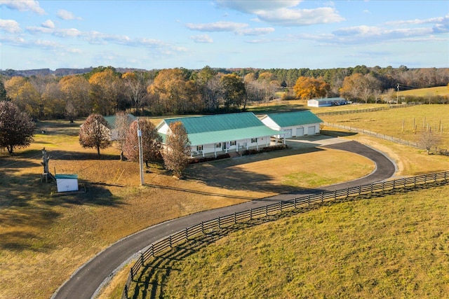 birds eye view of property featuring a rural view