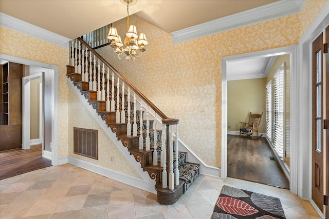 stairway featuring a notable chandelier and crown molding