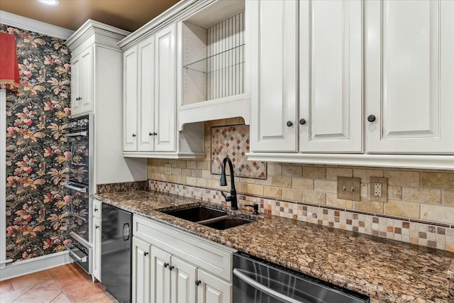 kitchen with sink, white cabinets, dark stone counters, and black appliances