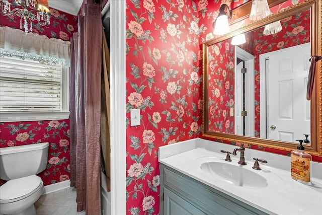 bathroom featuring vanity, toilet, and tile patterned flooring