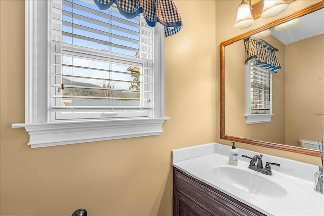 bathroom featuring vanity and toilet