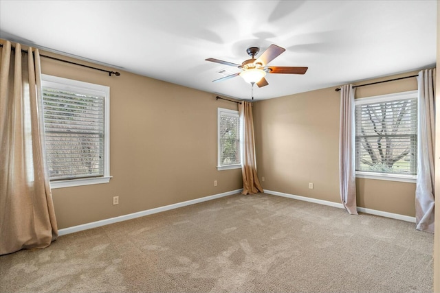 carpeted empty room with ceiling fan