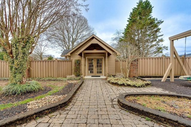 view of outbuilding featuring french doors