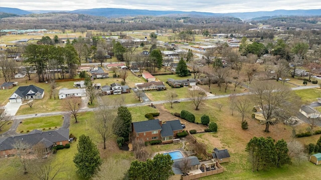 birds eye view of property with a mountain view