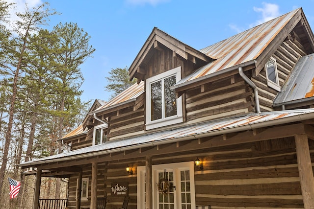 view of side of home with a porch