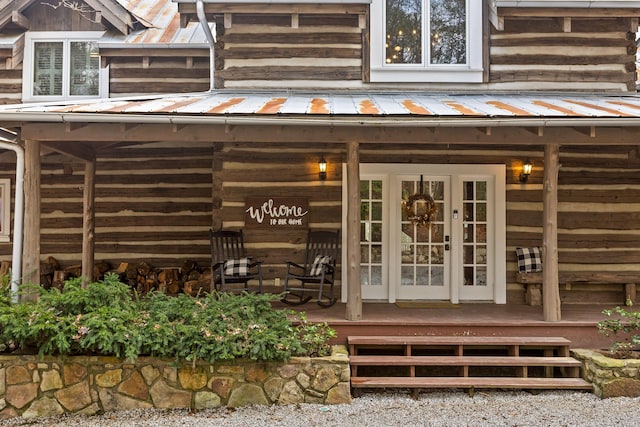 property entrance featuring a porch