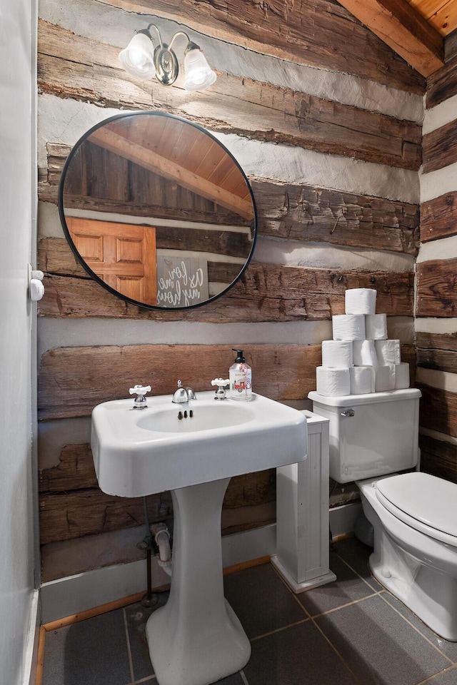 bathroom with tile patterned floors and toilet