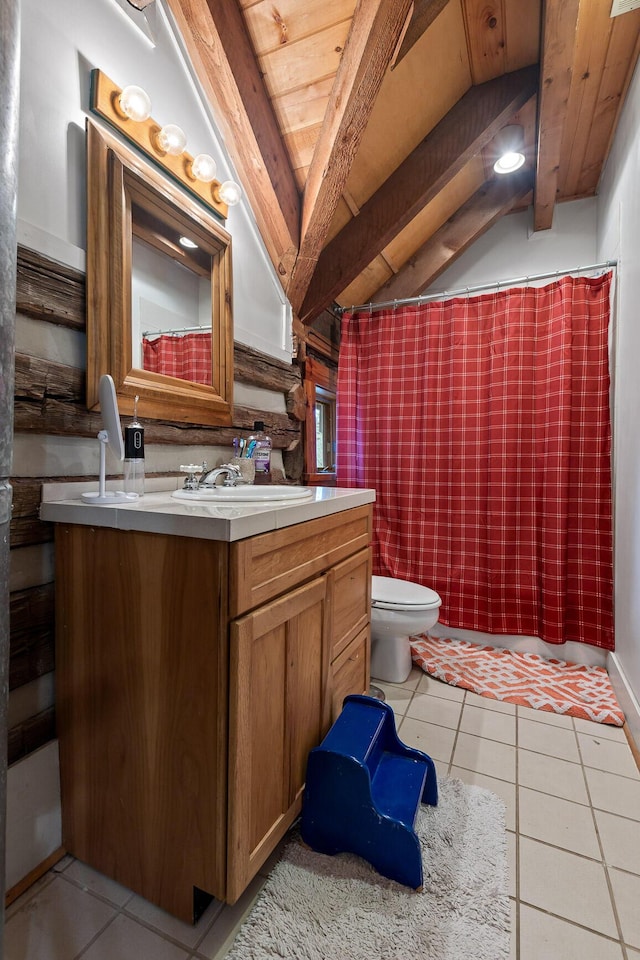 bathroom featuring vaulted ceiling with beams, toilet, curtained shower, tile patterned floors, and vanity