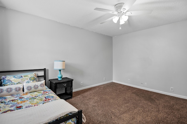 carpeted bedroom featuring a ceiling fan and baseboards