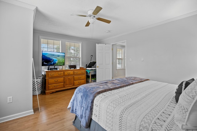 bedroom with ceiling fan, baseboards, light wood finished floors, and ornamental molding