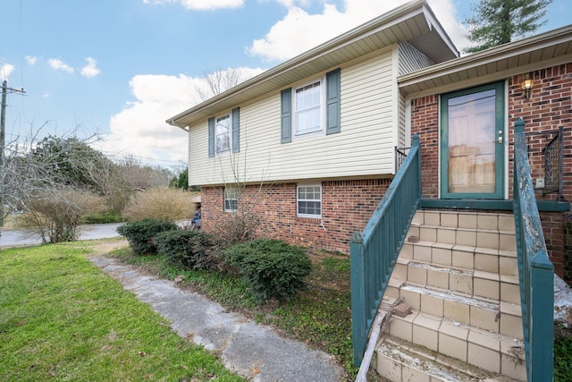 view of property exterior featuring a lawn