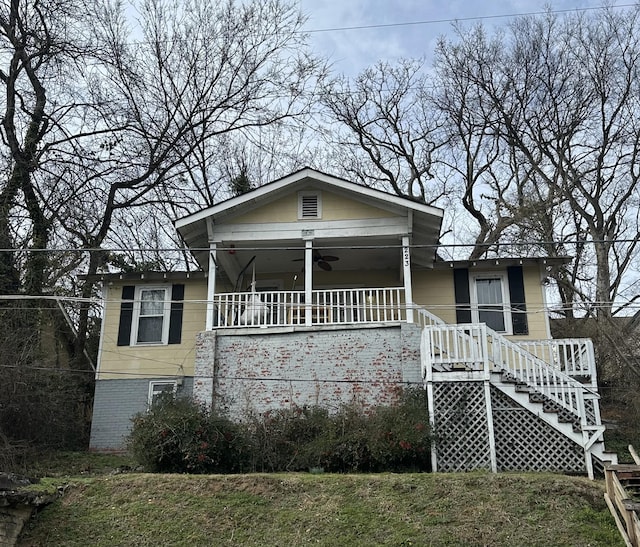 bungalow-style house featuring a porch and ceiling fan