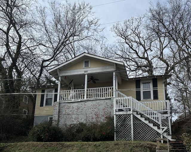 view of front of house with ceiling fan and covered porch