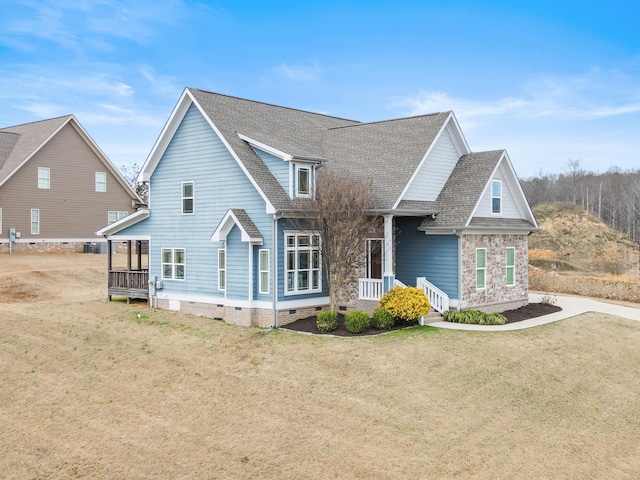 view of front of property with a porch and a front lawn