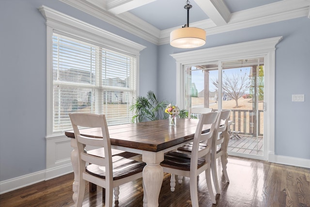 dining room featuring dark wood-type flooring, ornamental molding, and beamed ceiling