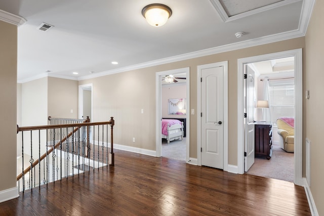 hallway featuring ornamental molding and dark hardwood / wood-style flooring