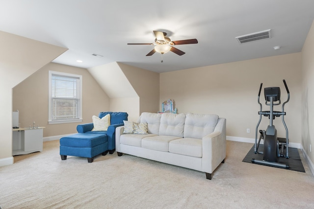 living room featuring lofted ceiling, light colored carpet, and ceiling fan