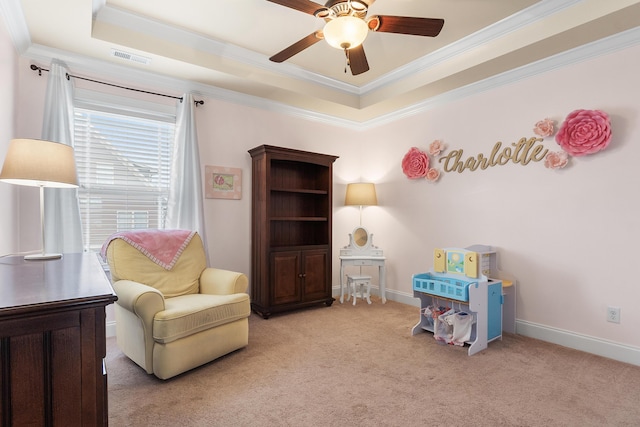 living area featuring crown molding, ceiling fan, a tray ceiling, and light carpet