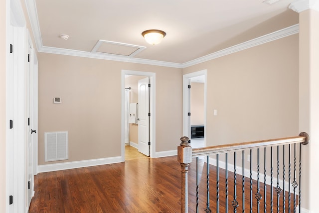 hall featuring wood-type flooring and crown molding