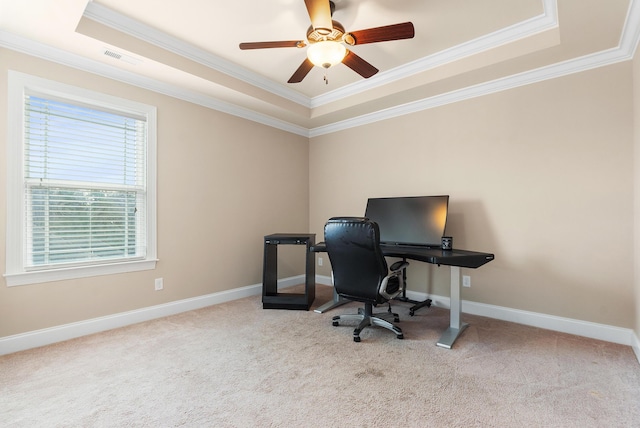 office featuring ornamental molding, light colored carpet, and a raised ceiling