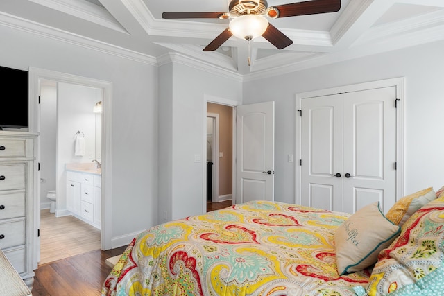 bedroom with coffered ceiling, dark hardwood / wood-style flooring, and a closet