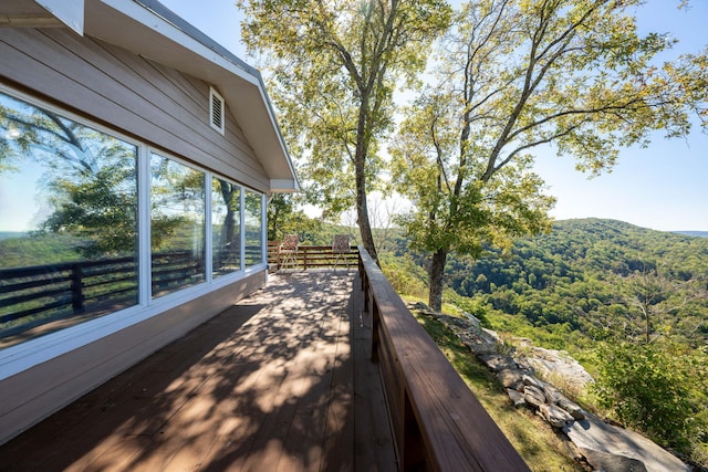 wooden terrace with a mountain view