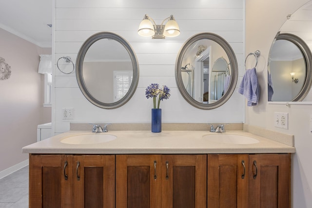 bathroom featuring ornamental molding and vanity