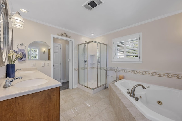 bathroom featuring crown molding, vanity, and independent shower and bath