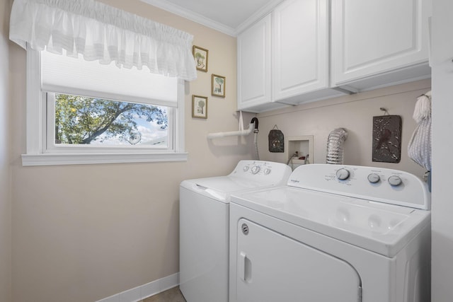 laundry area featuring cabinets, ornamental molding, and separate washer and dryer