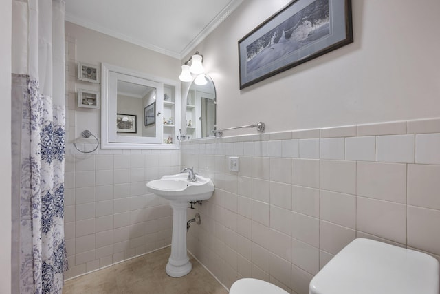 bathroom with toilet, sink, tile walls, ornamental molding, and tile patterned flooring