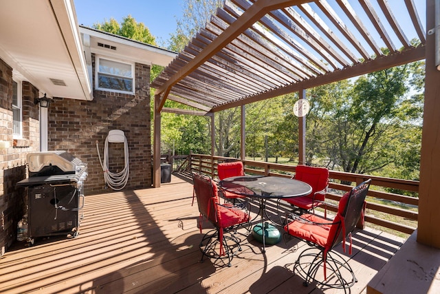 deck with area for grilling and a pergola