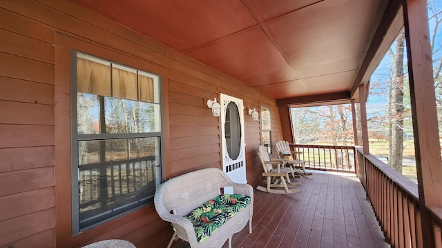 wooden terrace featuring a porch