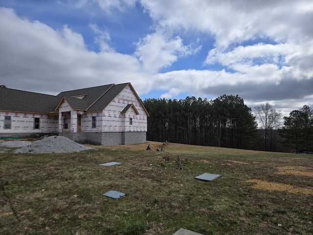 view of home's exterior featuring a yard