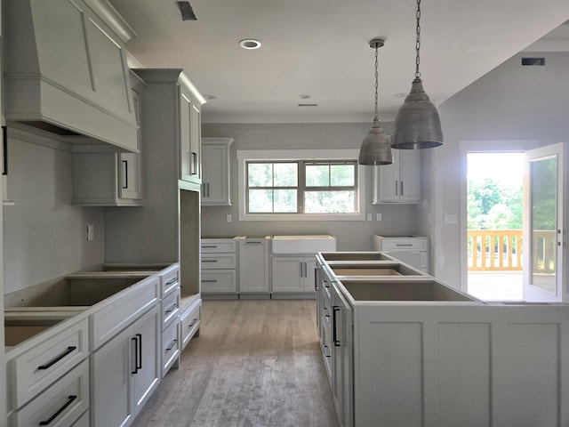 1646 Ritz Way Unit 4, Soddy Daisy, TN 37379 - kitchen featuring custom range hood, light wood finished floors, a center island, black electric cooktop, and recessed lighting