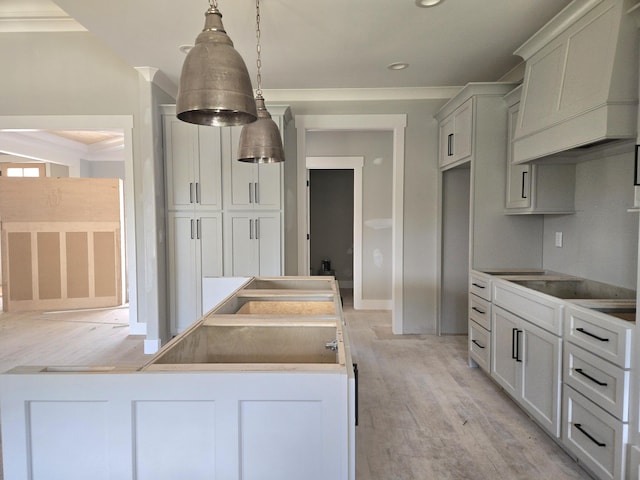 1646 Ritz Way Unit 4, Soddy Daisy, TN 37379 - kitchen with black electric stovetop, light wood-type flooring, custom exhaust hood, recessed lighting, and pendant lighting