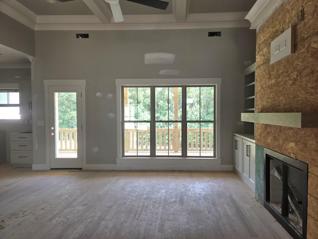 1646 Ritz Way Unit 4, Soddy Daisy, TN 37379 - unfurnished living room featuring a ceiling fan, a fireplace, light wood-style flooring, coffered ceiling, and beam ceiling