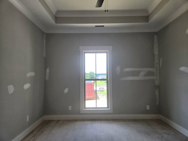 1646 Ritz Way Unit 4, Soddy Daisy, TN 37379 - empty room featuring wood finished floors, a raised ceiling, and ceiling fan